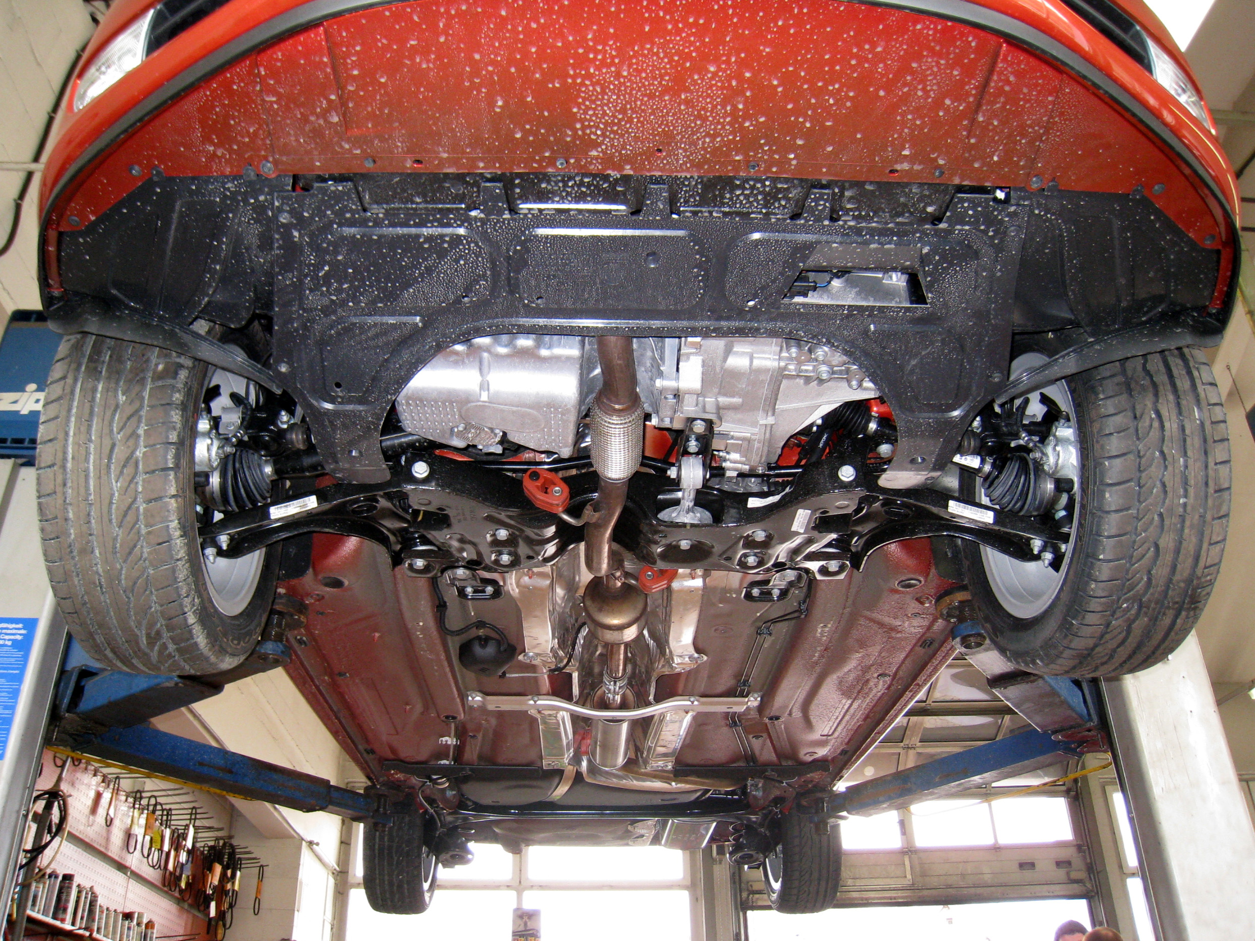 A Škoda Fabia underbody with largely intact coatings, suspension components and exhaust